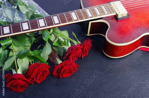 Acoustic Guitar And A Bouquet Of Red Roses Buy Photos Ap