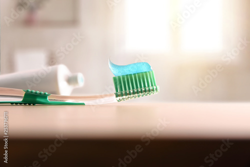 Concept oral hygiene with toothbrush on wood table in bathroom © Davizro Photography