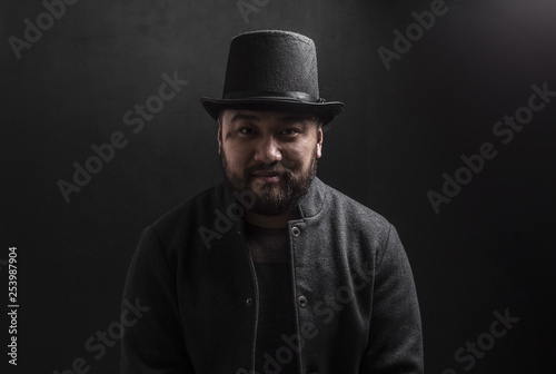 portrait of a Chinese in top hat,portrait of a vintage chinese businessman © serikbaib