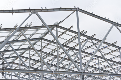 Structure of building from galvanized metal. Steel construction on sky background. Metal galvanizing technology to prevent corrosion. © Vasiliy Ulyanov