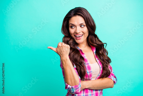 Close up photo beautiful amazing she her lady hand arm finger look amazed empty space advising new product wearing casual plaid checkered pink shirt outfit isolated teal bright vivid background