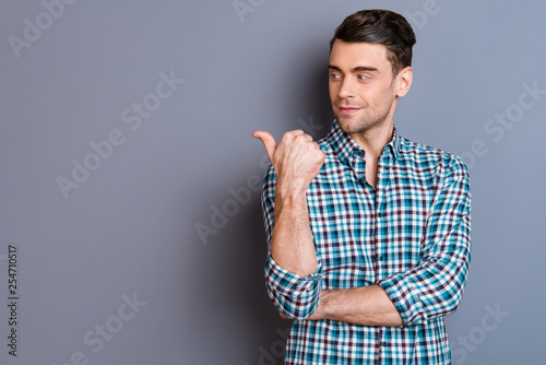 Close up photo attractive amazing he him his man hands arms finger show look empty space interested curious perfect hair styling wearing casual plaid checkered outfit isolated grey background