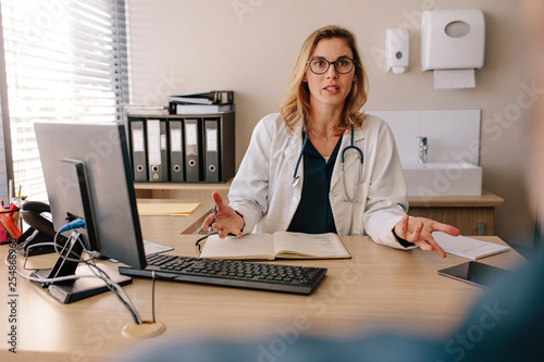 Female doctor consulting a patient in clinic