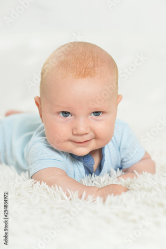 Portrait of beautiful baby boy on bed © aletia2011