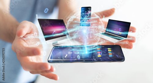 Modern devices connected in businessman hand 3D rendering © sdecoret