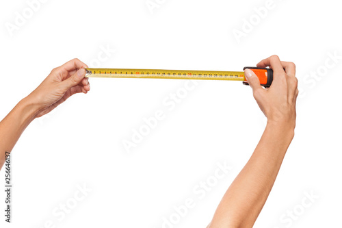 Close Up Of Woman's Hands Holding Yellow Roll Measure. © studioloco