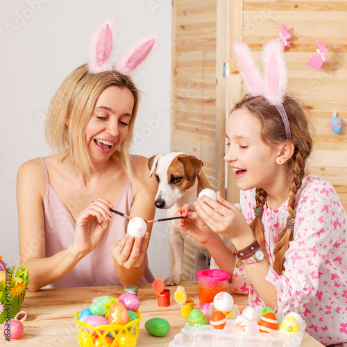 Happy woman with child paint easter eggs © Tatyana Gladskih