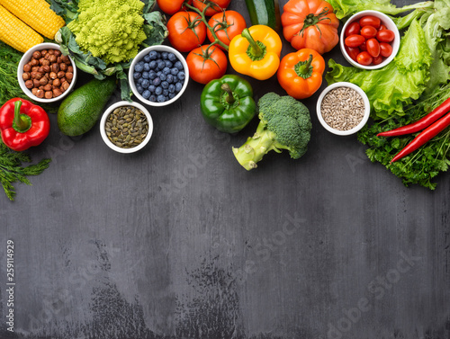 Healthy eating ingredients: fresh vegetables, fruits and superfood. Nutrition, diet, vegan food concept © Maksim Šmeljov