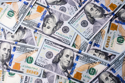 American 100 dollar banknotes placed on white background