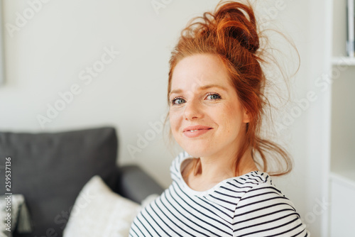 Smiling friendly young redhead woman © contrastwerkstatt