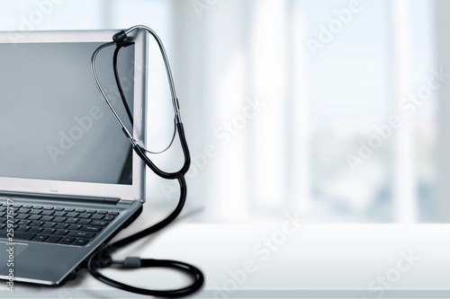 Laptop diagnosis with stethoscope on background © BillionPhotos.com