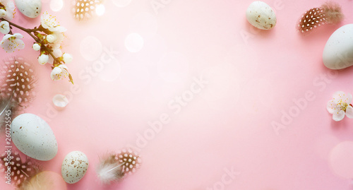 Easter background; Easter Eggs with spring Flowers on pink Background © Konstiantyn