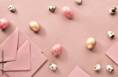 Easter flat lay on cream paper with quail eggs, greeting cards and envelopes © tilialucida