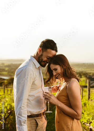 Romantic couple standing together in a vineyard © Jacob Lund 