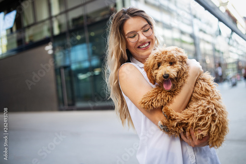 Beauty woman with her dog playing outdoors © nd3000
