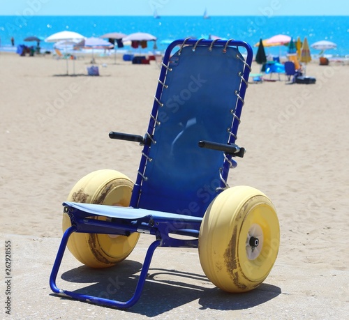 wheelchair with large yellow wheels © ChiccoDodiFC