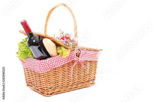picninc basket with wine, cheese and fruit © M.studio