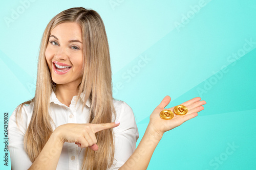 Woman holding a physical bitcoin cryptocurrency © fotofabrika